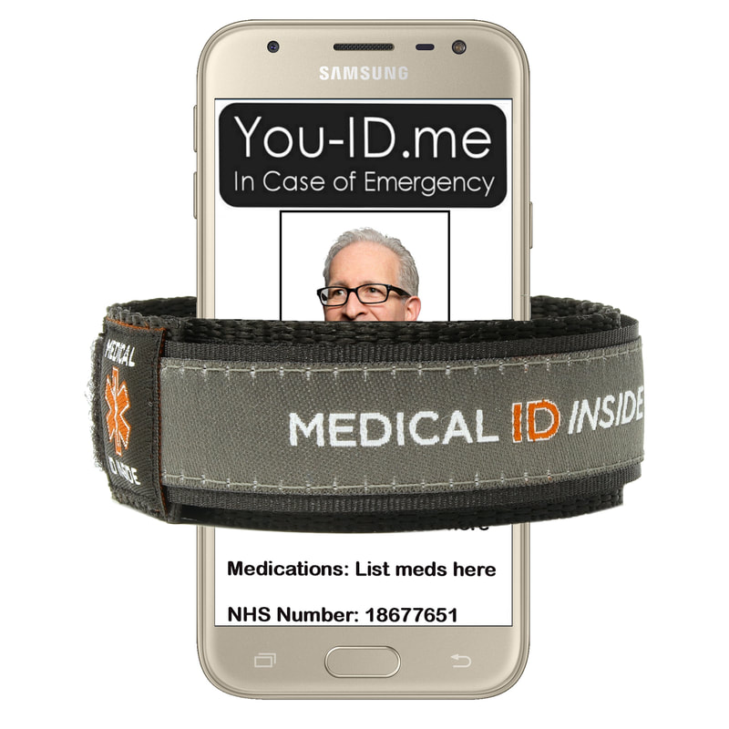 Grey medical alert bracelet shown with mobile phone
